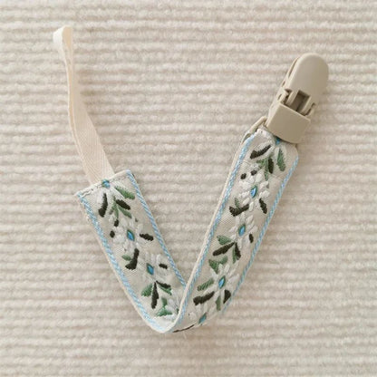 attache sucette nomade feuille verte