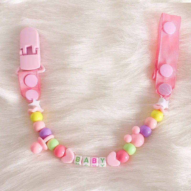 attache tetine silicone rose