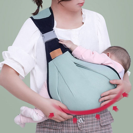 bébé endormi dans portage en écharpe bulle de calme vert