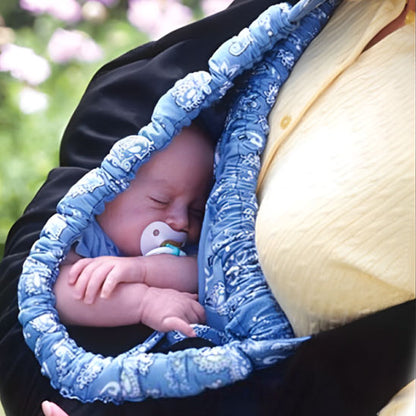 bébé endormit confortablement dans portage echarpe bebe