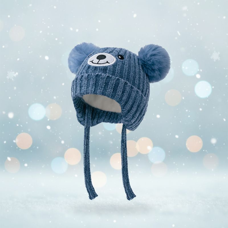 bonnet bébé bleu avec cordons tressés