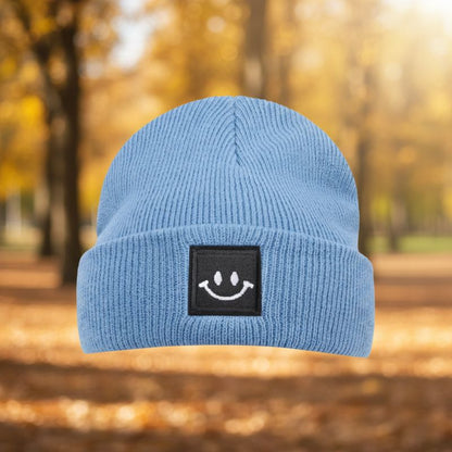 bonnet bébé bleu avec patch sourire