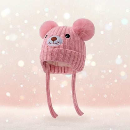 bonnet bébé rose avec cordons tressés