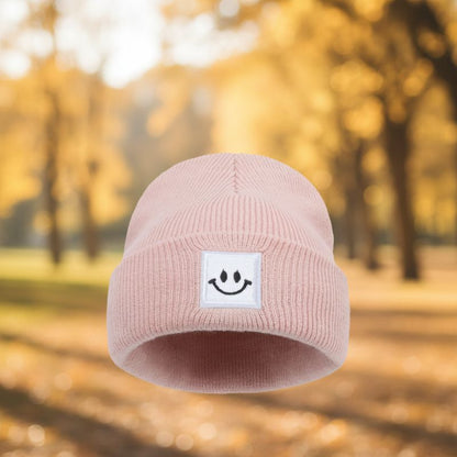 bonnet bébé rose avec patch sourire