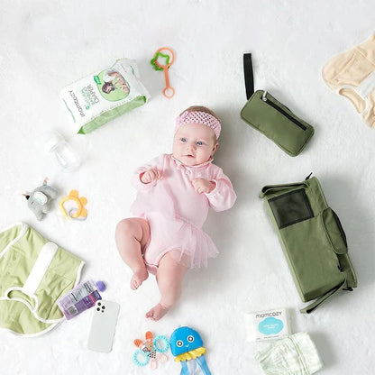sac à langer avec bébé allongé nomado vert